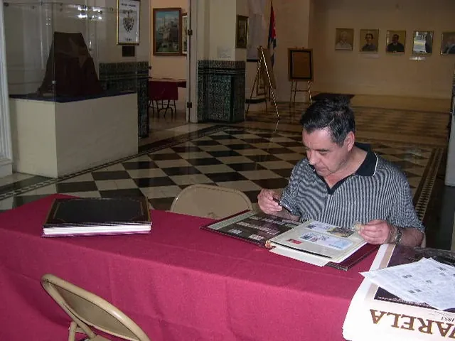 Visitor reviewing stamps